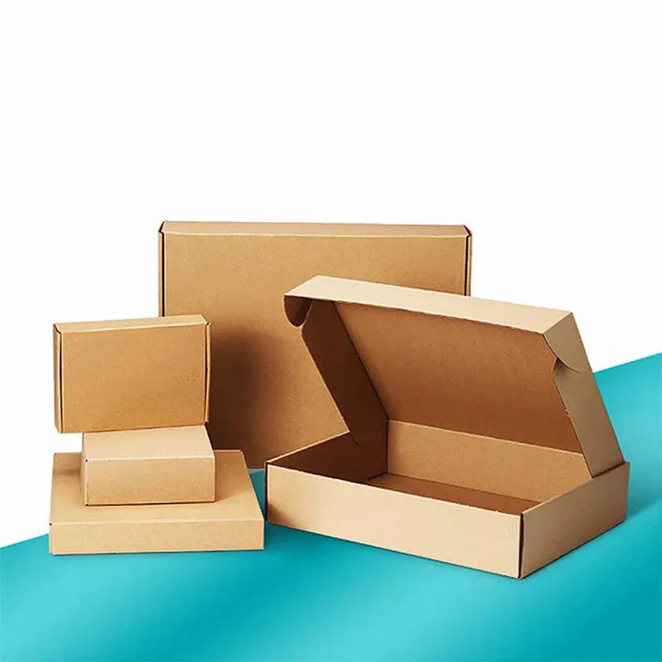 Brown Kraft Mailer Boxes: Plain kraft mailers in several sizes, the largest open with its tuck front raised