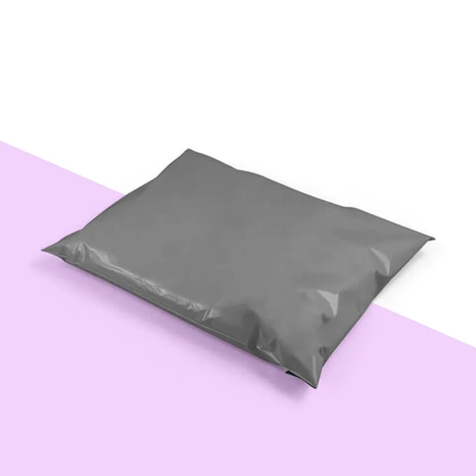 Compostable Mailers: Plain grey soft mailer bag lying flat, flap sealed, with no print