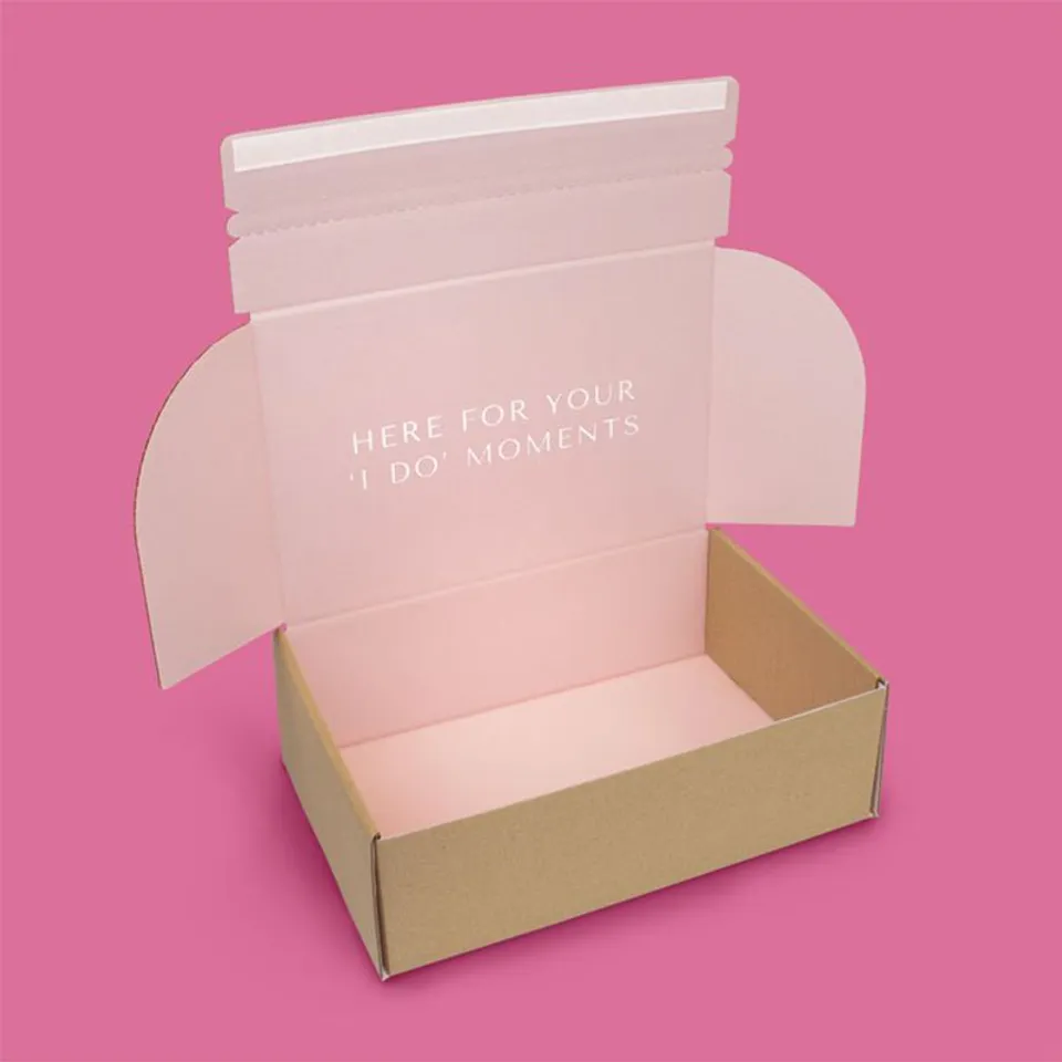 Double Sided Printed Mailer Boxes: Kraft outside with a soft pink print covering the inside, lid flaps and a short line