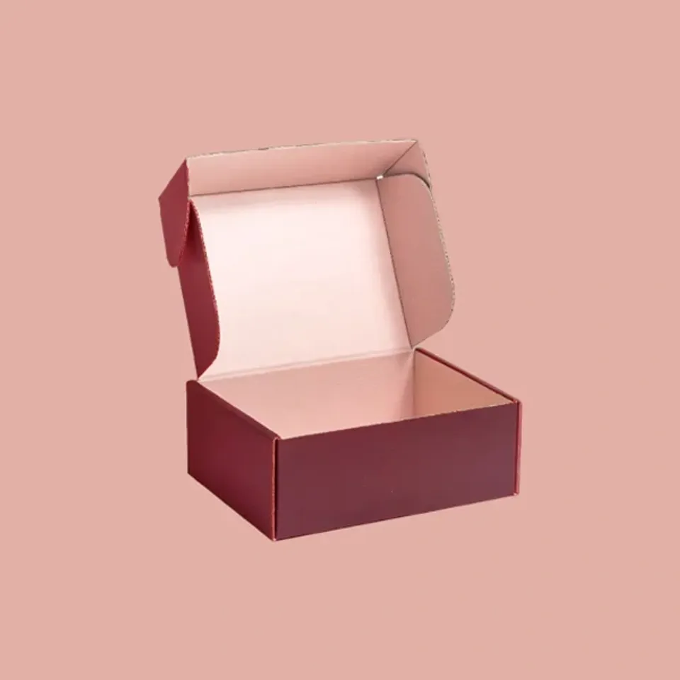 Ear Lock Mailer Boxes: Burgundy mailer standing open, pale pink inside, with the lid's side ears raised