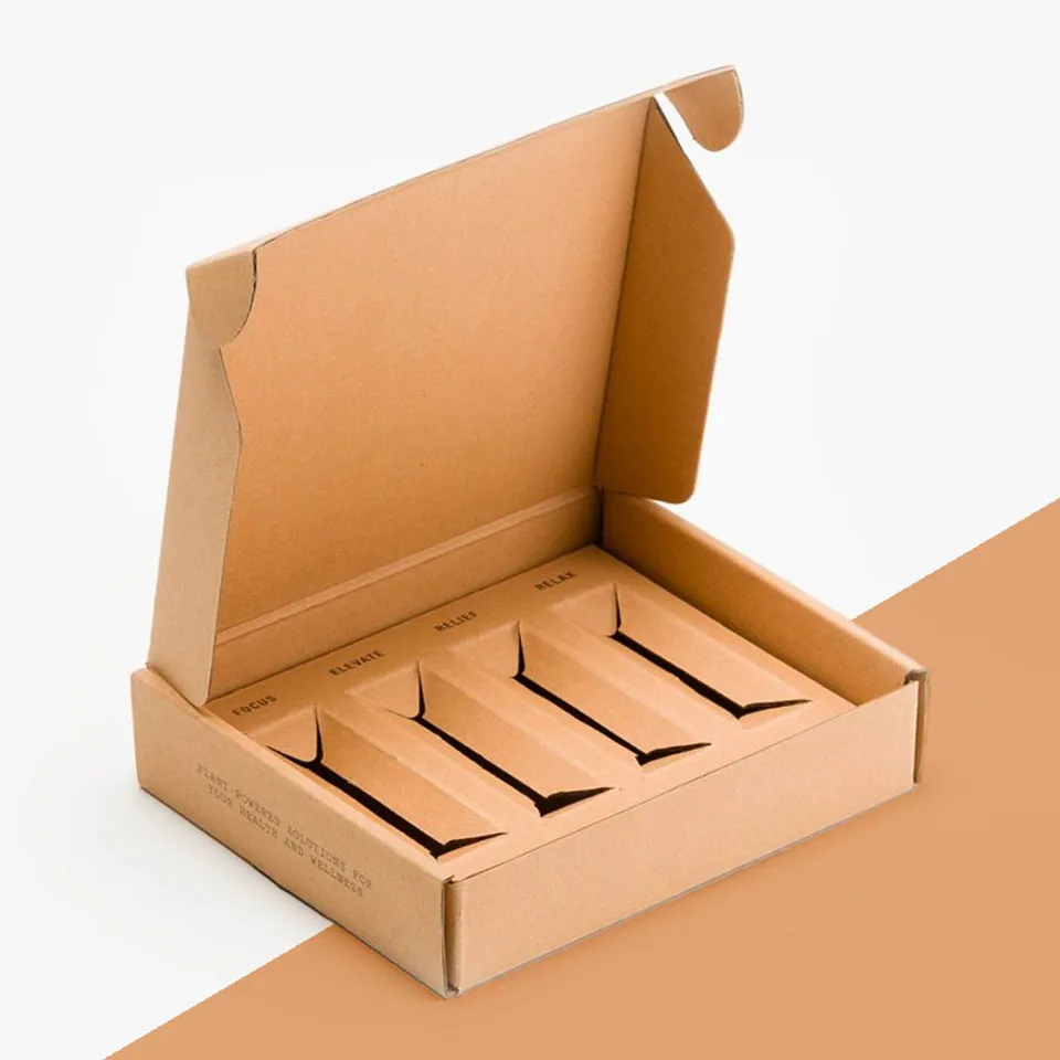 Insert Fitted Mailer Boxes: Plain kraft mailer with four narrow slots cut in the insert, one name beside each