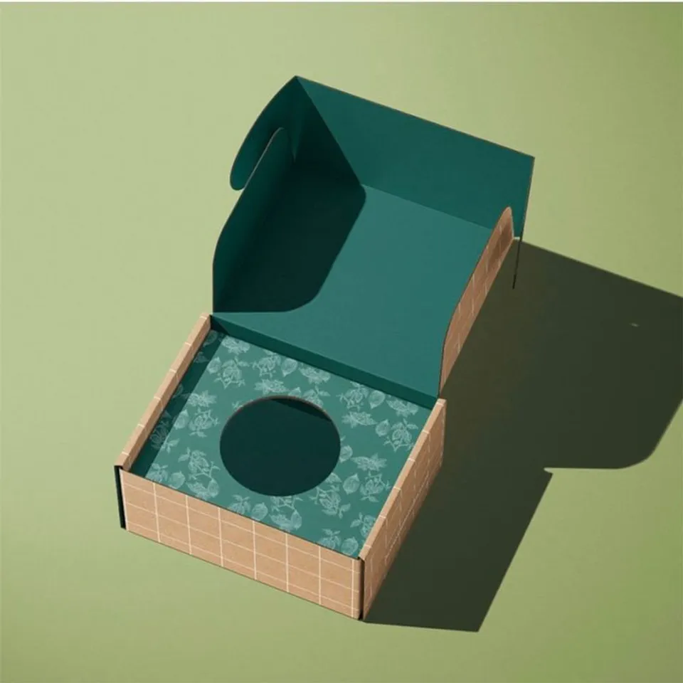 Subscription Box Mailers: Grid print box, dark teal inside the lid, floral insert with a round cut-out