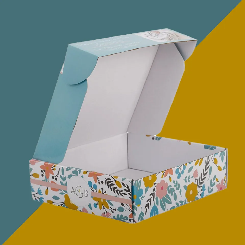 White Mailer Boxes: White board printed with a floral pattern outside, plain white inside, pale blue lid